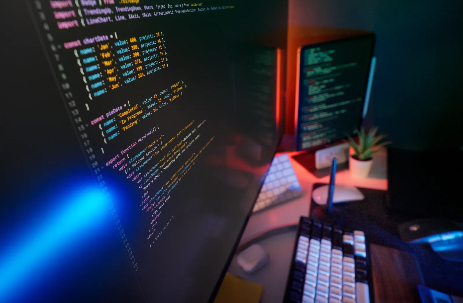Code for a business dashboard on a monitor in a dimly lit office
